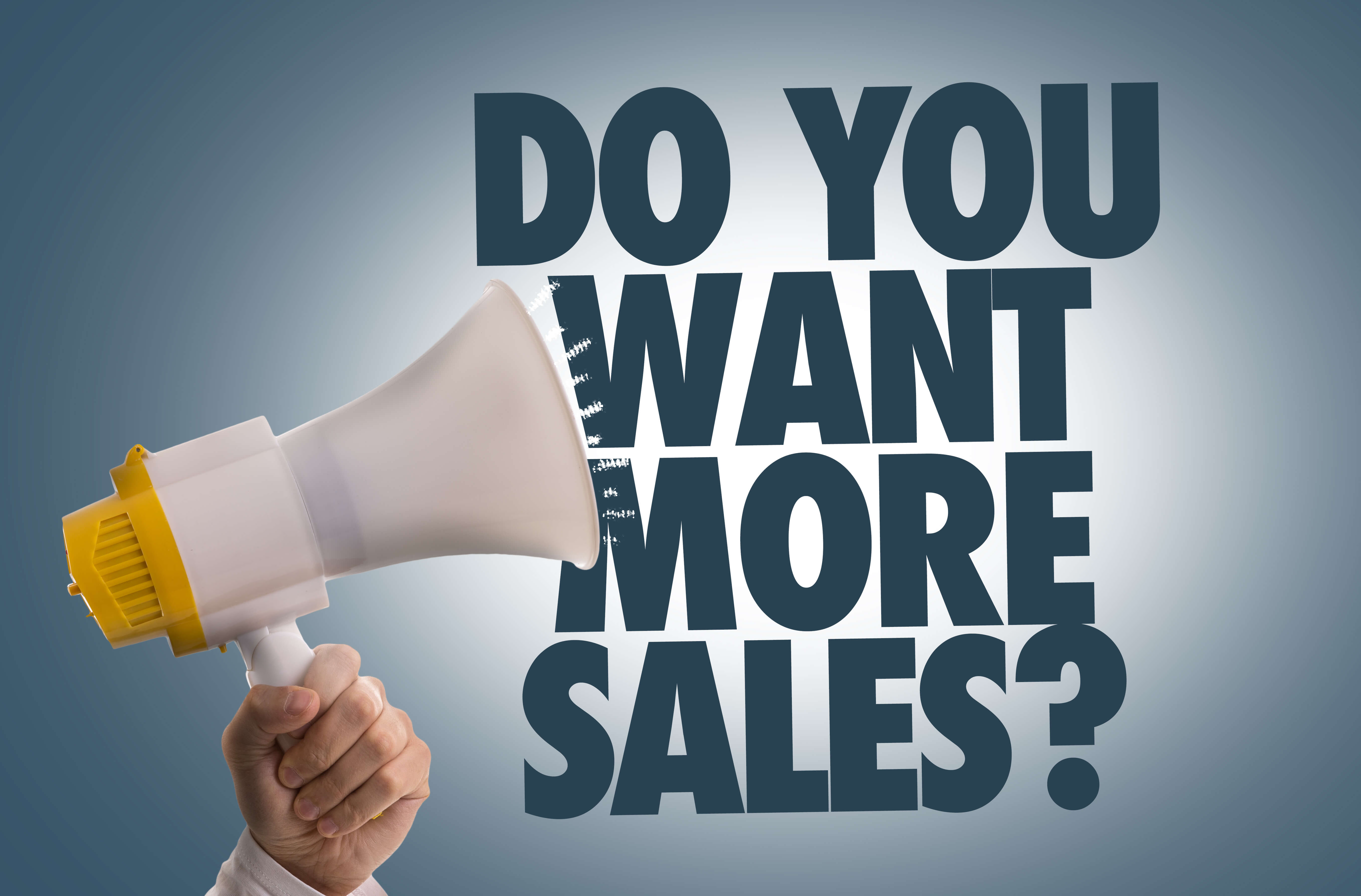 Hand holding megaphone with upselling question in text